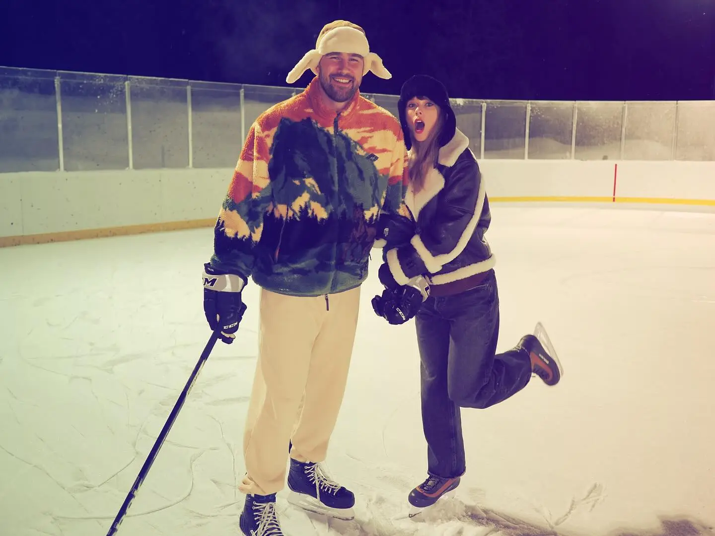 Travis Kelce and Taylor Swift ice skating.