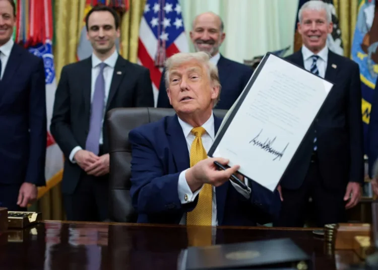 Confused Trump raises eyebrows as he stumbles through order-signing on ‘crypto-graffey’