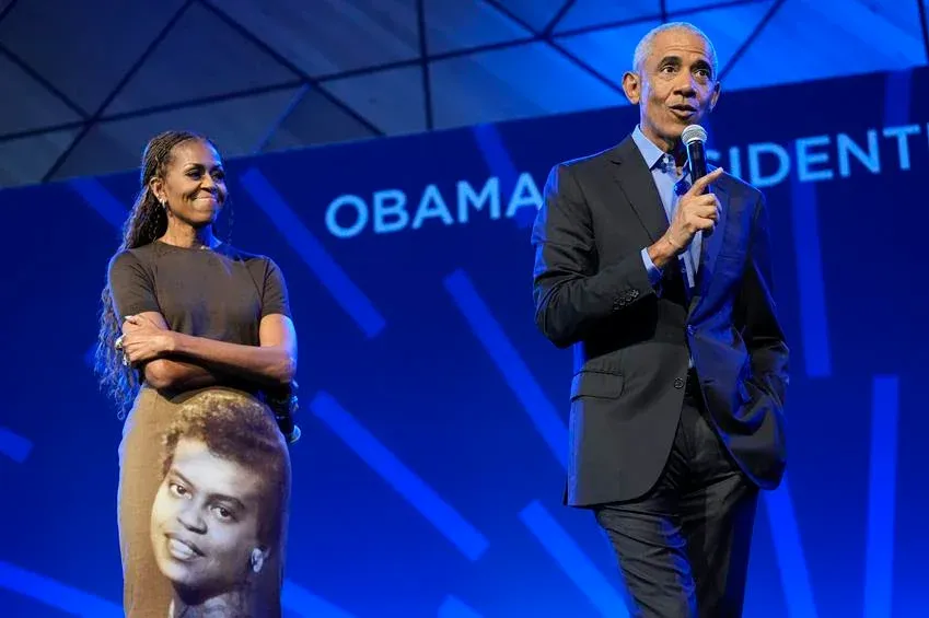 Former President Barack Obama and former first lady Michelle Obama speak onstage at the Obama Presidential Center on June 16, 2026 in Chicago, Illinois. Source: Getty