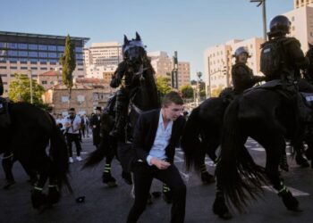 Ultra-Orthodox protesters block roads and trains across Israel over military draft