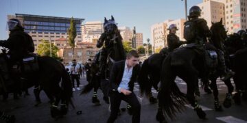 Ultra-Orthodox protesters block roads and trains across Israel over military draft