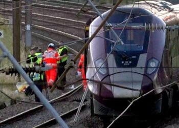 U.K. police investigate cause of train collision that killed driver and left 9 critically hurt