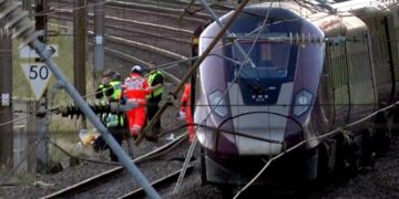 U.K. police investigate cause of train collision that killed driver and left 9 critically hurt