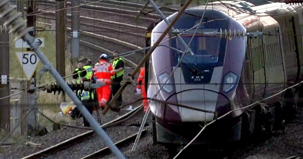 U.K. police investigate cause of train collision that killed driver and left 9 critically hurt