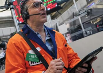 The Dow leaps to a record as oil prices ease and stocks outside of AI rally
