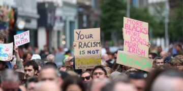 Thousands rally in Belfast to condemn racism and anti-immigrant rioting that followed stabbing