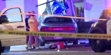 Shooting ends with woman dead, car crashing into beauty salon near Inglewood