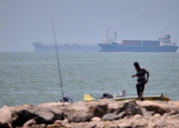 Iranian drones attack Bahrain and a ship is struck in the strait after U.S. airstrikes
