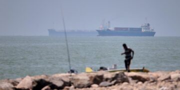 Iranian drones attack Bahrain and a ship is struck in the strait after U.S. airstrikes