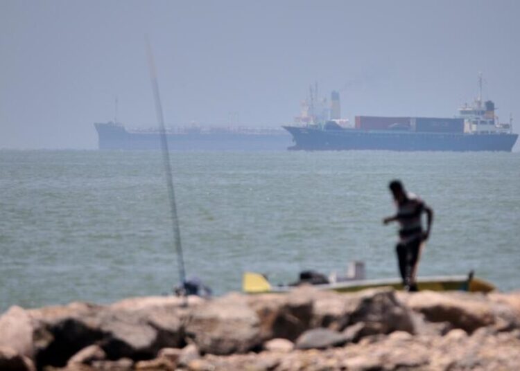 Iranian drones attack Bahrain and a ship is struck in the strait after U.S. airstrikes