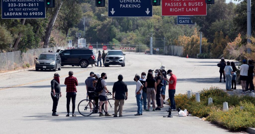 Dodgers fulfill $1-million pledge in response to ICE raids, owners divest from prison group