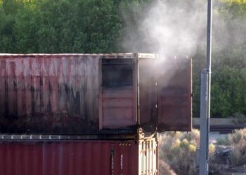 Rail car loaded with lithium batteries bursts into flames in Cajon Pass