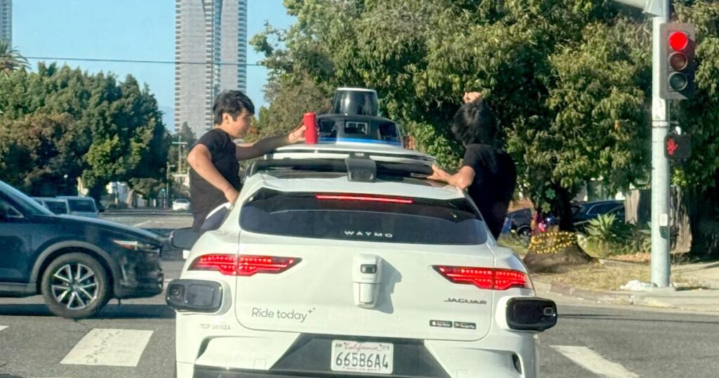 Kids sit in windows as Waymo travels through Westside. Witness alerts company; car doesn’t stop