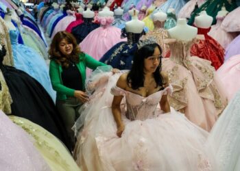 ‘We’re in survival mode’: A year after ICE raids, a couple fight to save their dress shops
