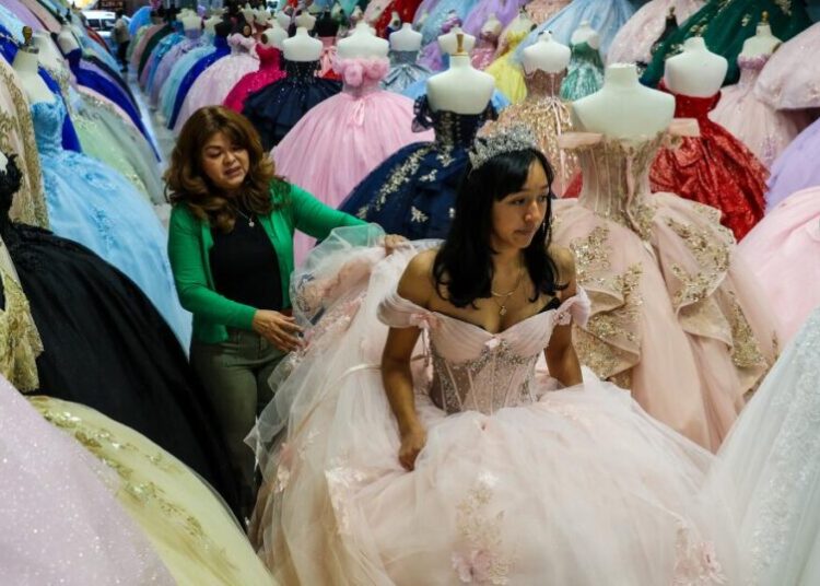 ‘We’re in survival mode’: A year after ICE raids, a couple fight to save their dress shops