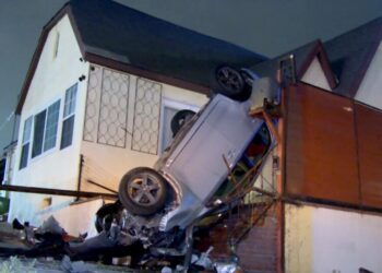 Car winds up upside down on the porch of a Wilmington home