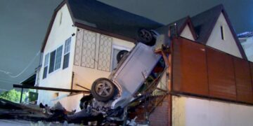 Car winds up upside down on the porch of a Wilmington home