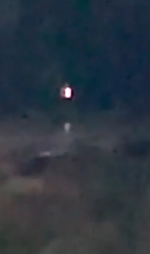 A glowing orb in the night sky.