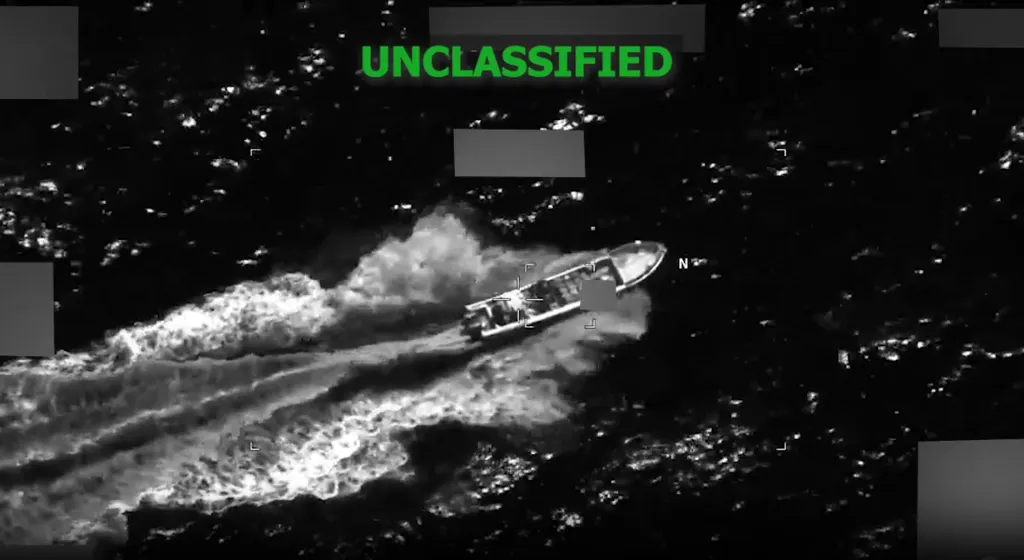 Thermal image from an aerial perspective showing a drug boat on the water, with 