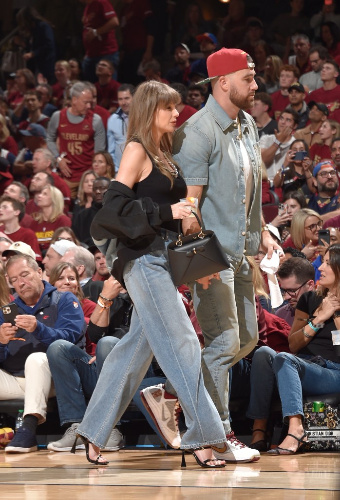 Taylor Swift and Travis Kelce attending a basketball game.