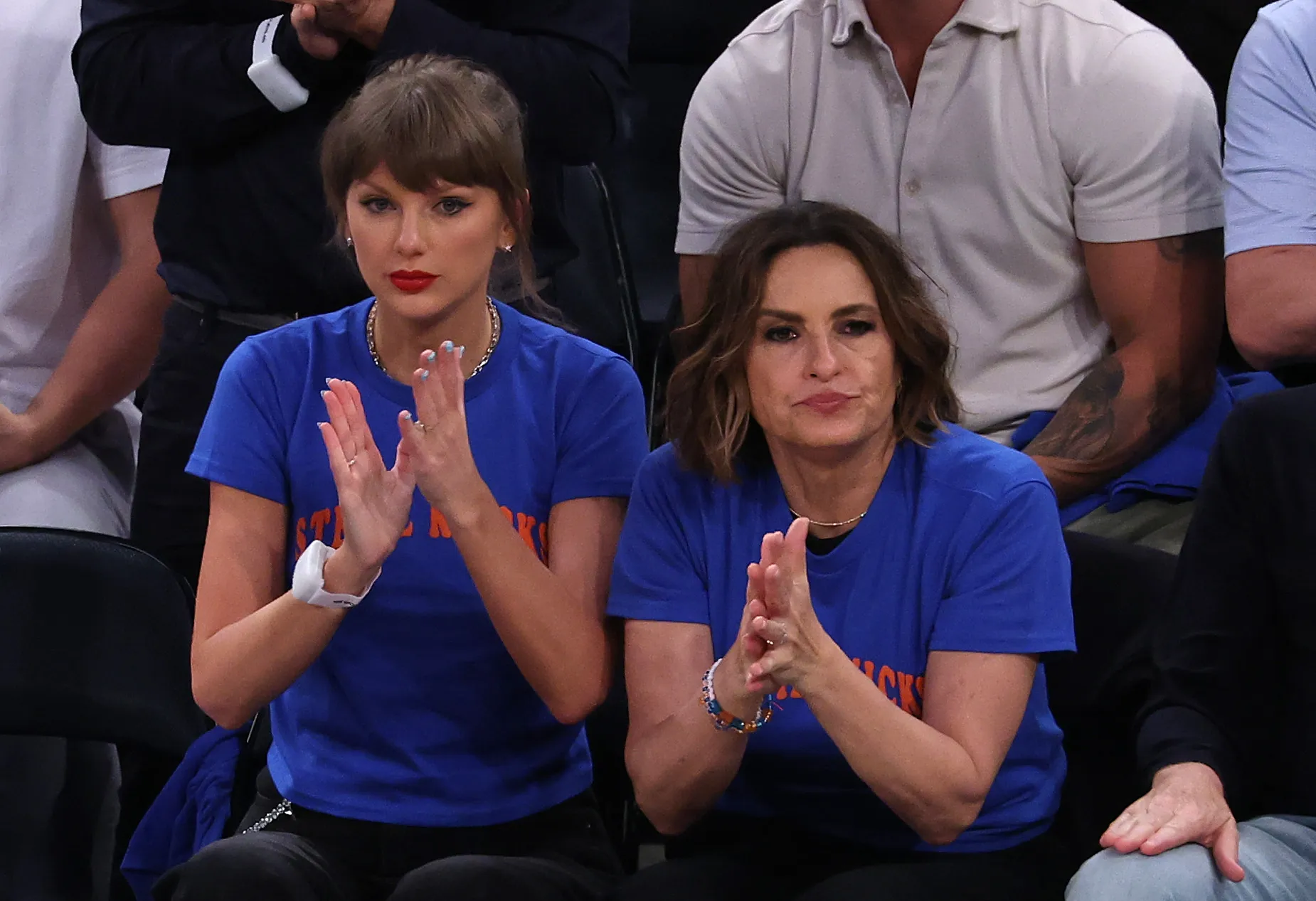 Taylor Swift and Mariska Hargitay clapping while attending Game Four of the 2026 NBA Finals.