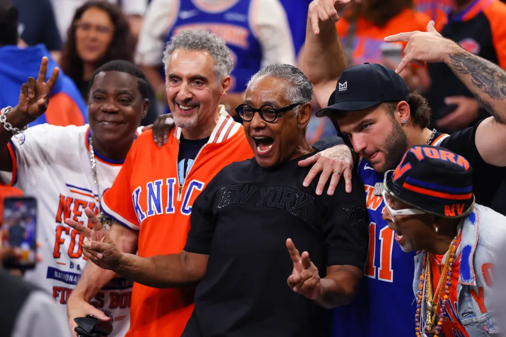Tracy Morgan, John Turturro, and Giancarlo Esposito posing for a photo.