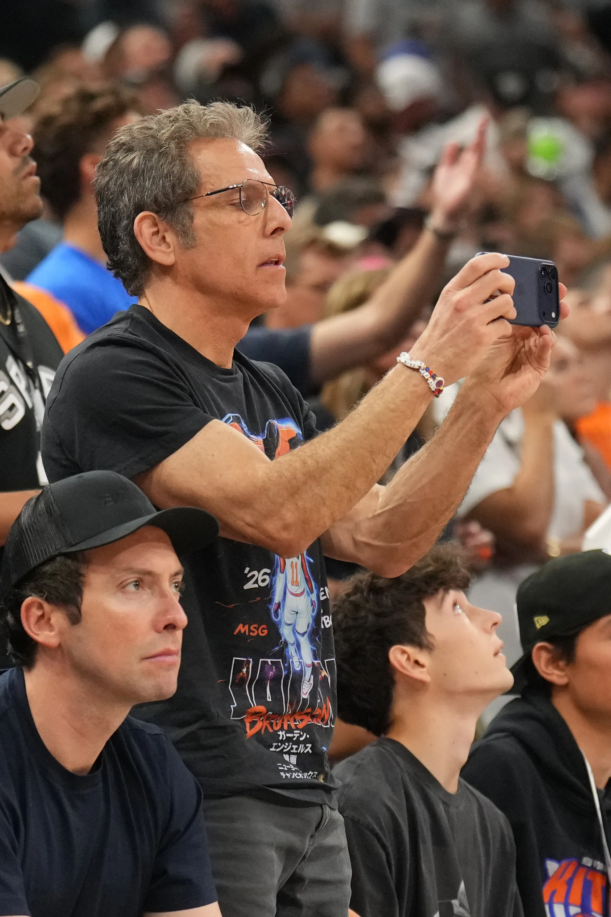 Ben Stiller films the NBA Finals with his phone.