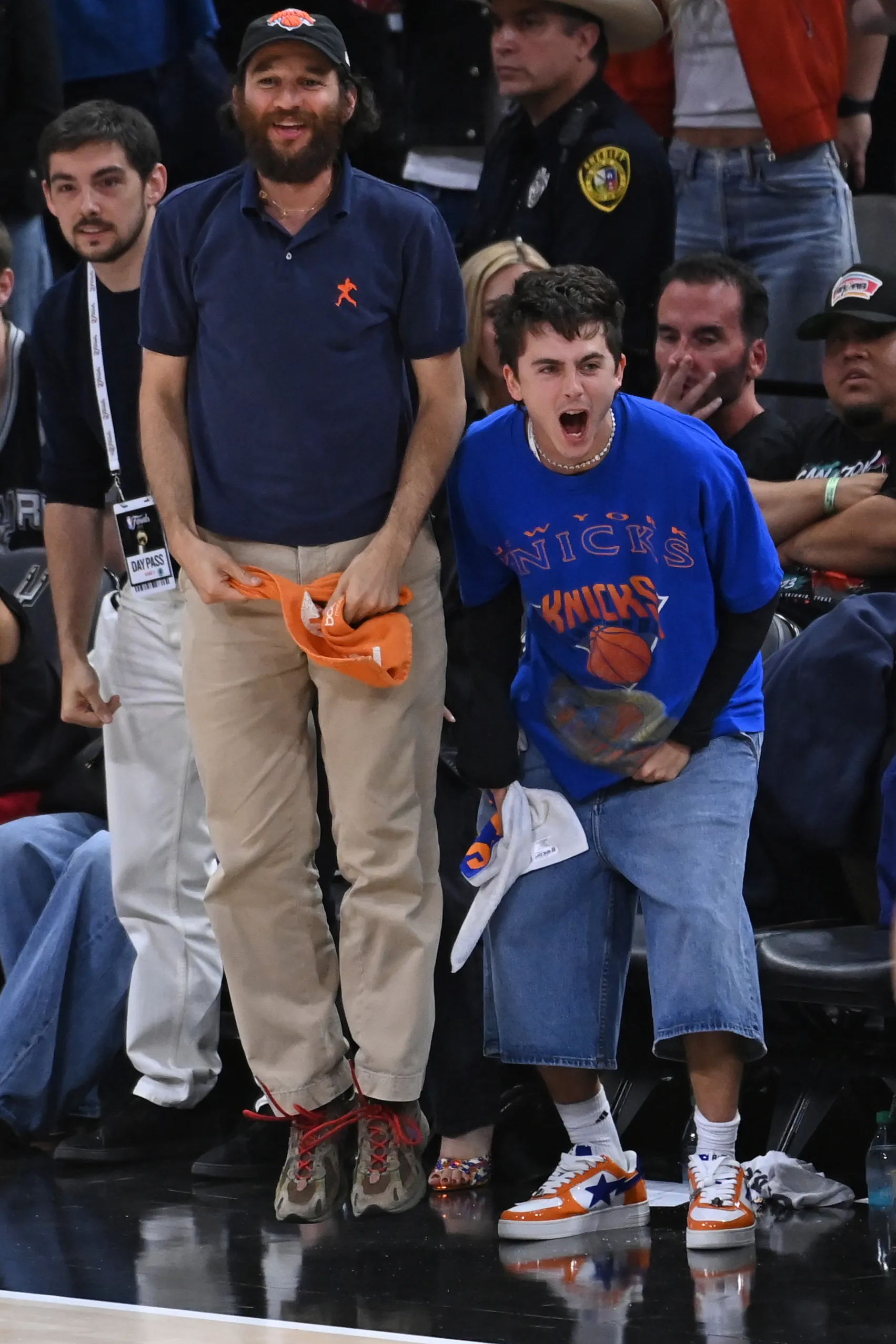Timothée Chalamet and Josh Safdie celebrating during the 2026 NBA Finals.