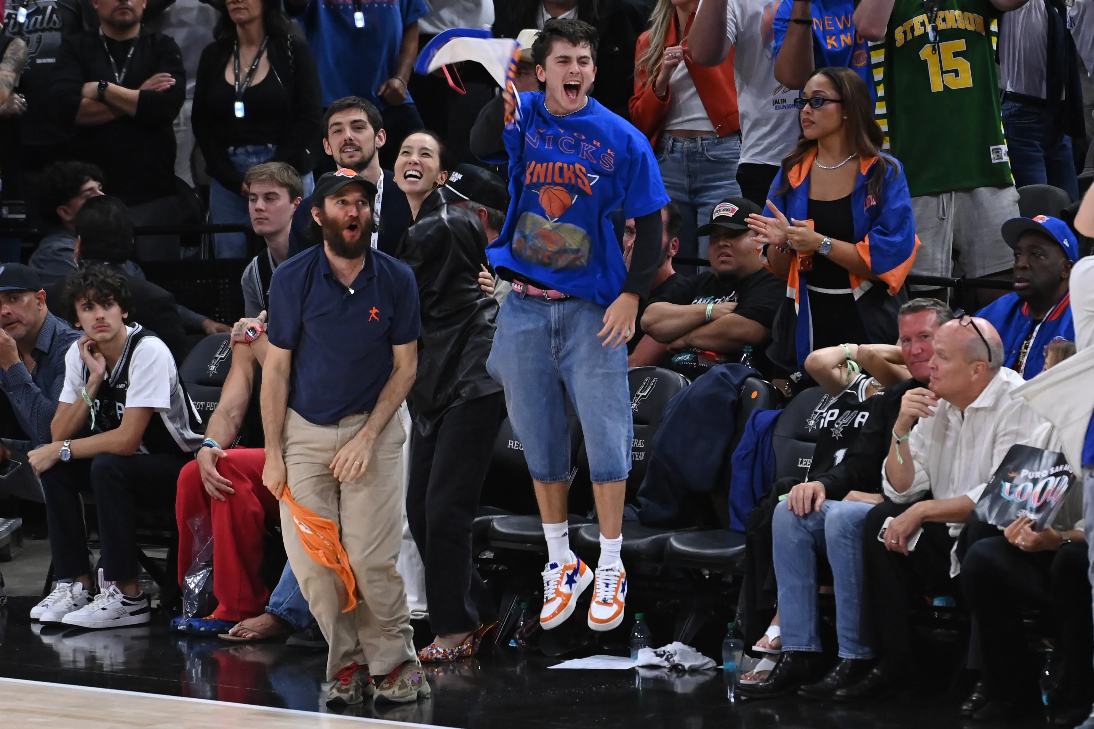 Timothée Chalamet cheering with Josh Safdie at the 2026 NBA Finals.