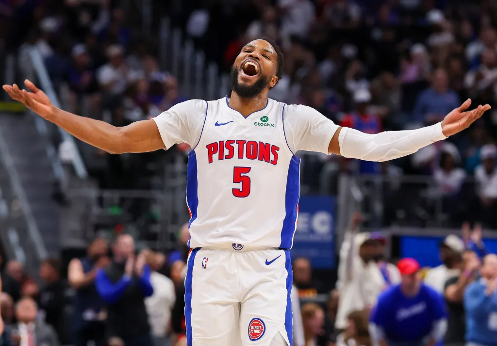 Malik Beasley #5 of the Detroit Pistons with arms outstretched and mouth open in reaction during Game Four of the Eastern Conference First Round NBA Playoffs.