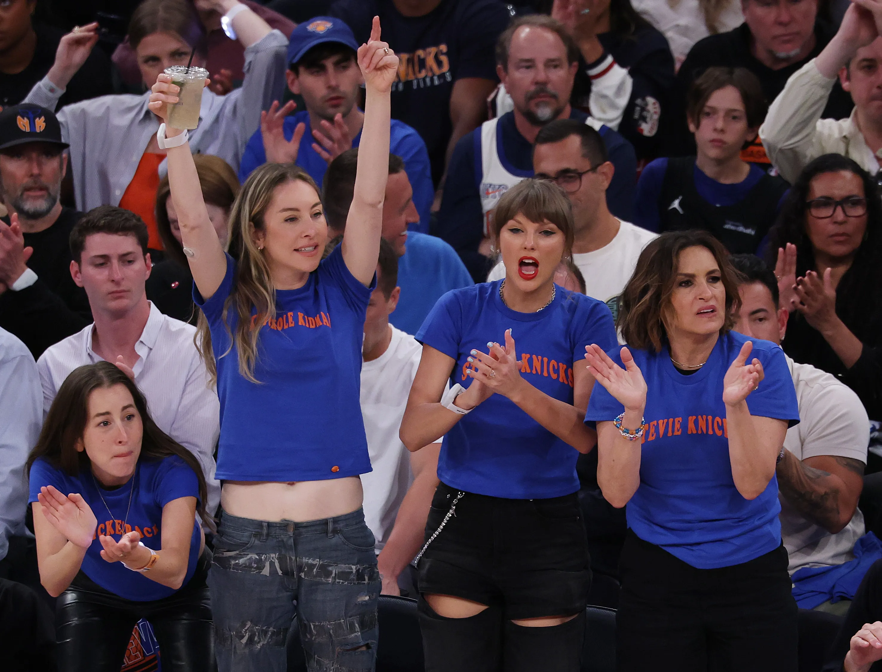 Este Haim, Taylor Swift, and Mariska Hargitay reacting during the 2026 NBA Finals.