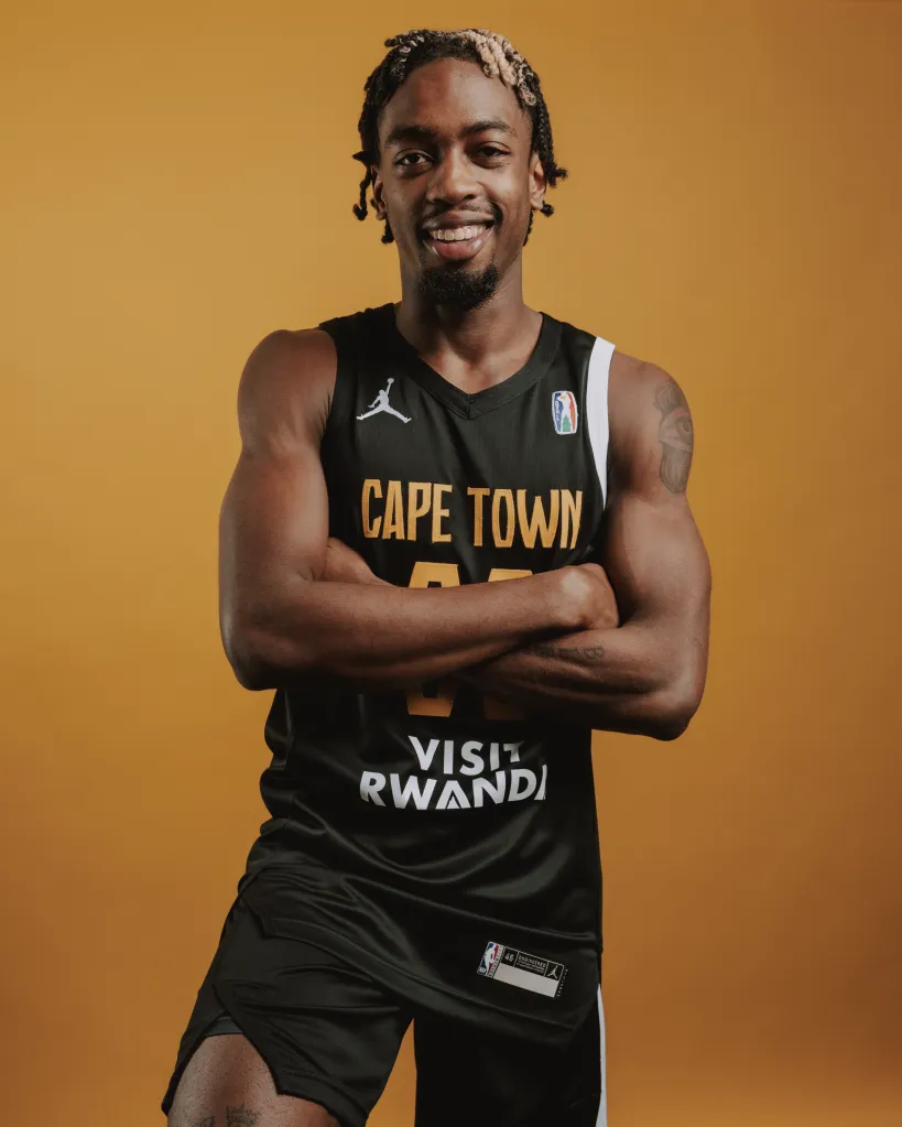 Zaire Wade of Cape Town posing for a portrait in his basketball uniform.