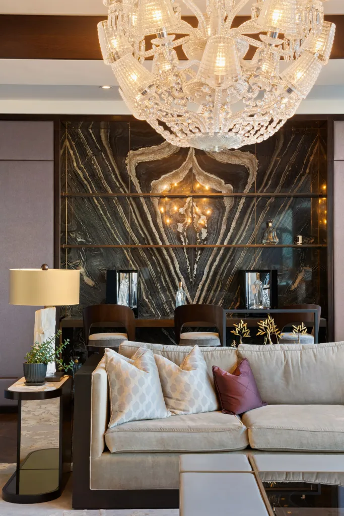 The living spaces are grand, featuring stone walls.