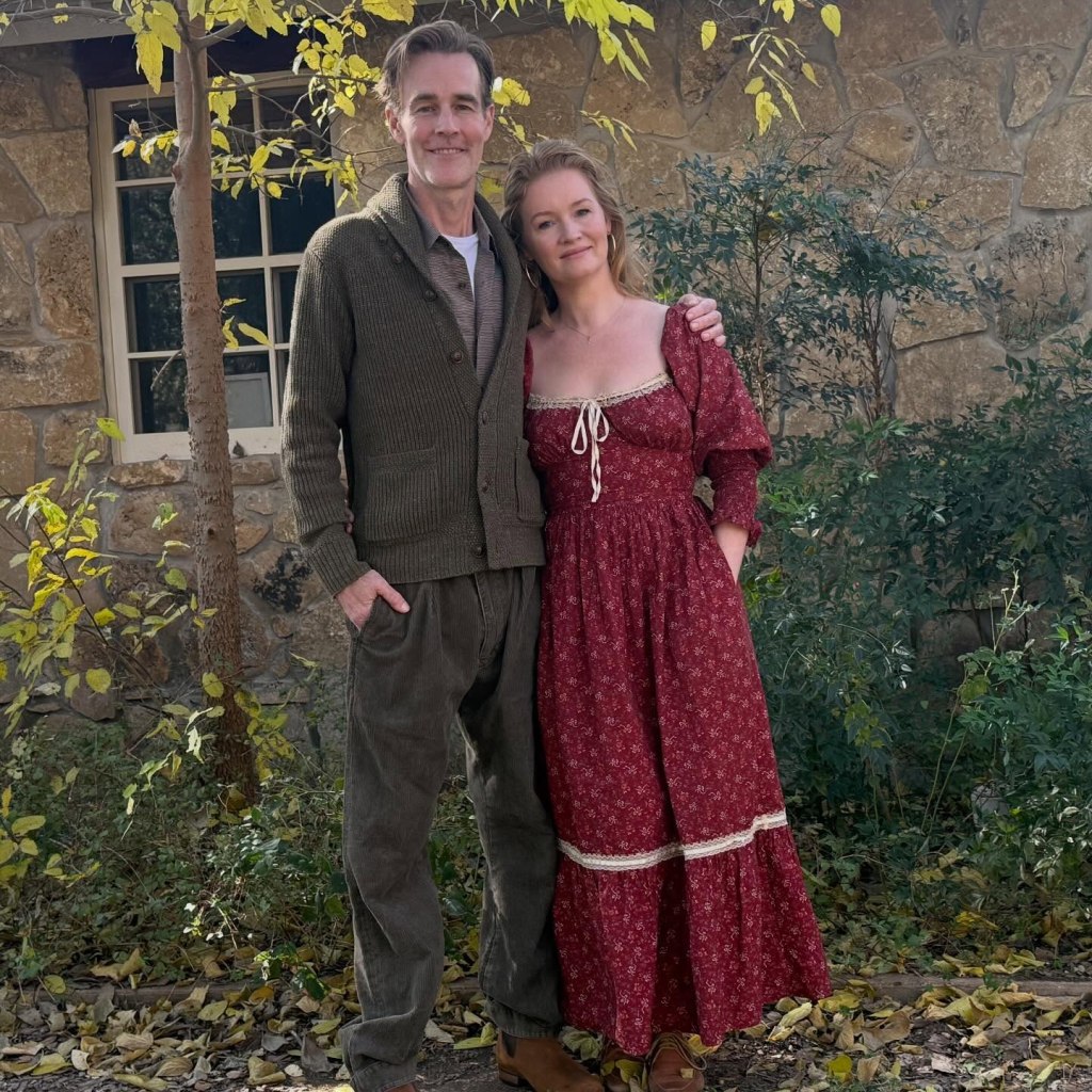 James and Kimberly Van Der Beek standing next to each other outdoors.