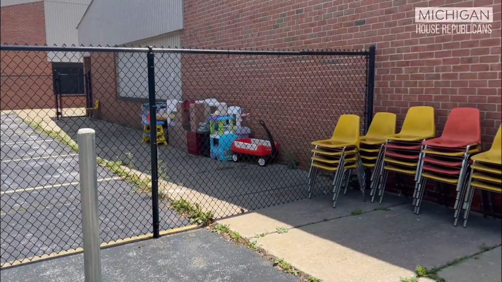 Investigators said Woolford found an outdoor play area consisting of a fenced-in asphalt lot with grass growing through the pavement.