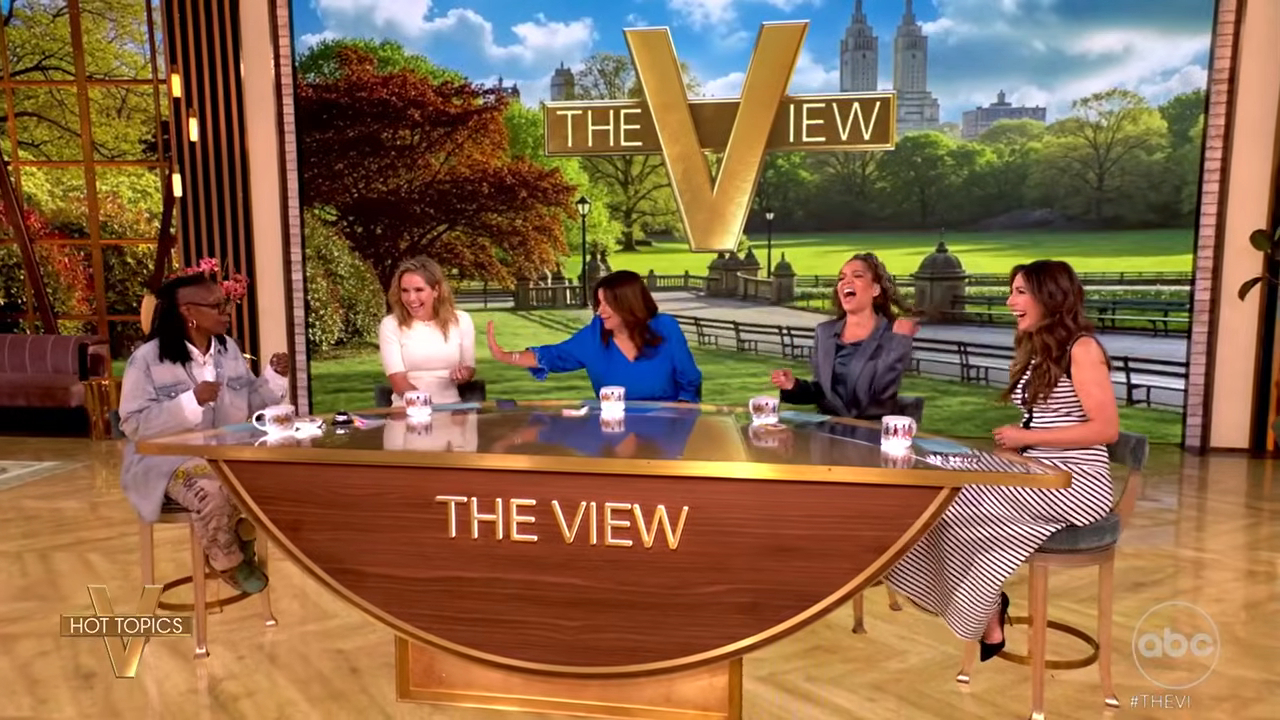 Whoopi Goldberg and other hosts of The View laugh at the Hot Topics roundtable.