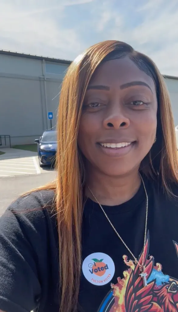 Tiffany Henyard smiling after voting, with an 