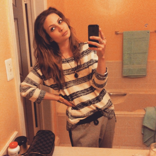 Daveigh Chase taking a selfie in a mirror.
