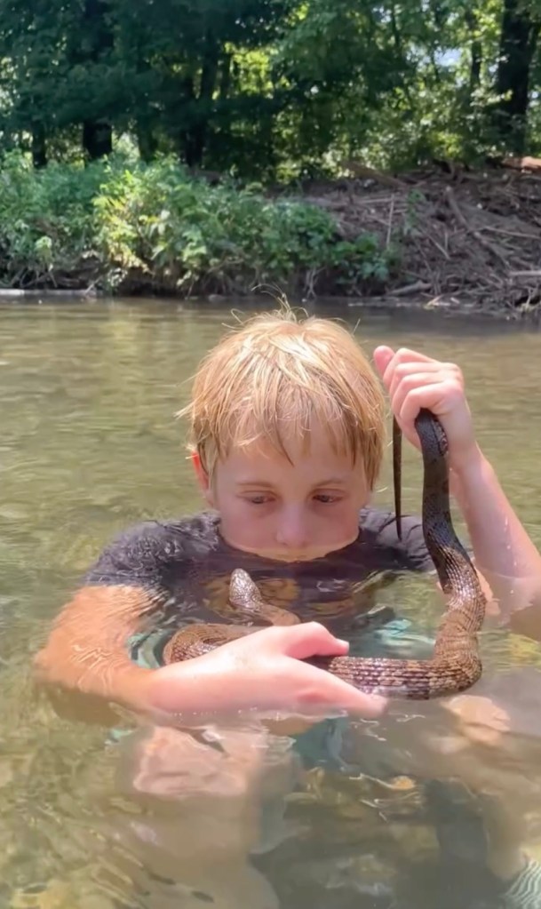 Koto in the water with a Midland snake. 