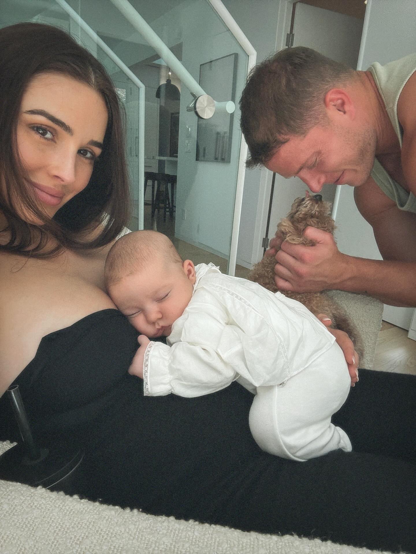 Olivia Culpo with her husband, baby, and dog.