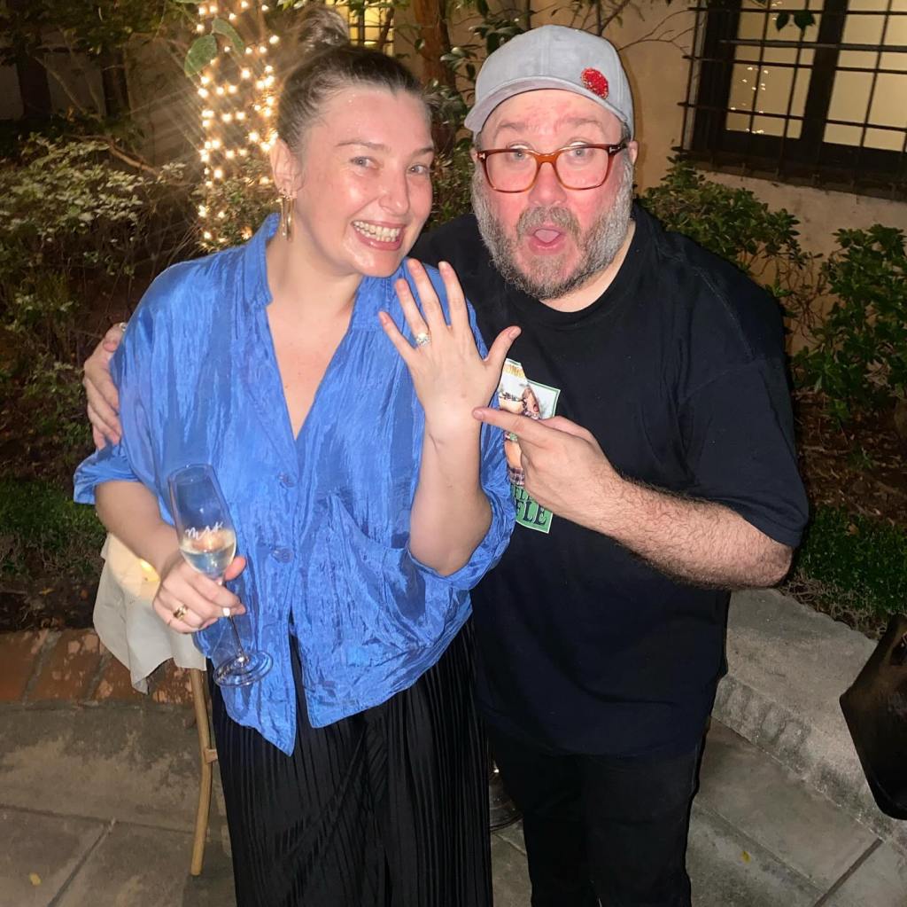 Trent Olsen and his wife Alexis posing for a photo.