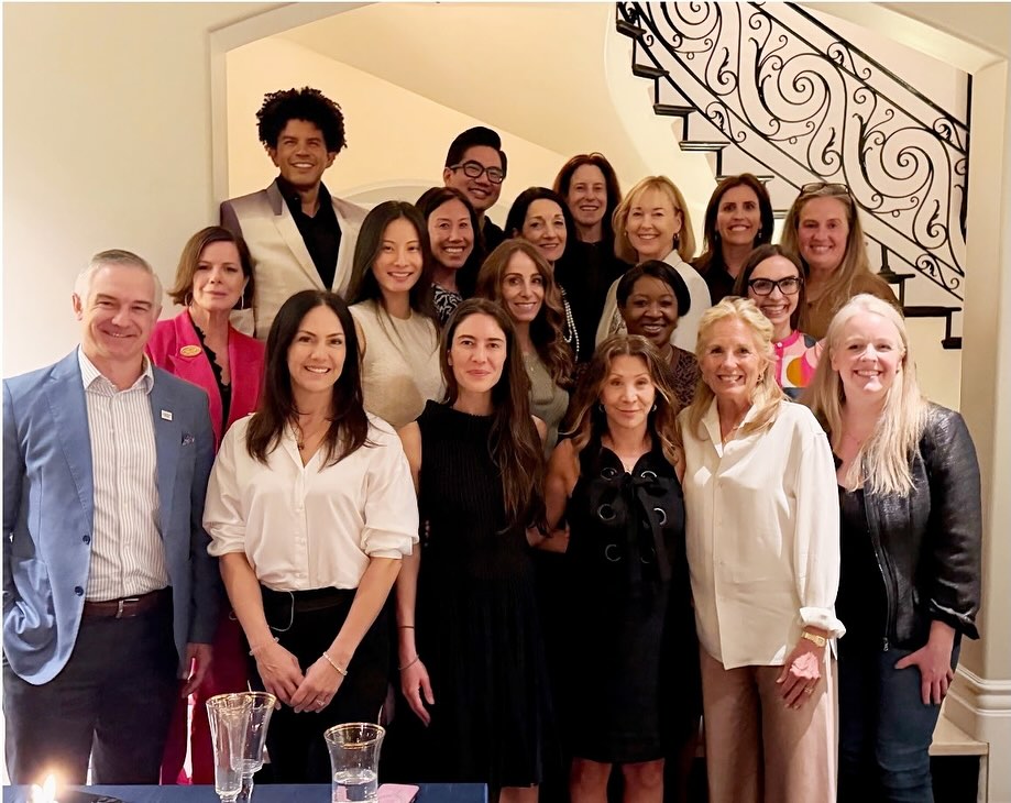 Cheri Oteri and Jill Biden posing for a group photo with others.
