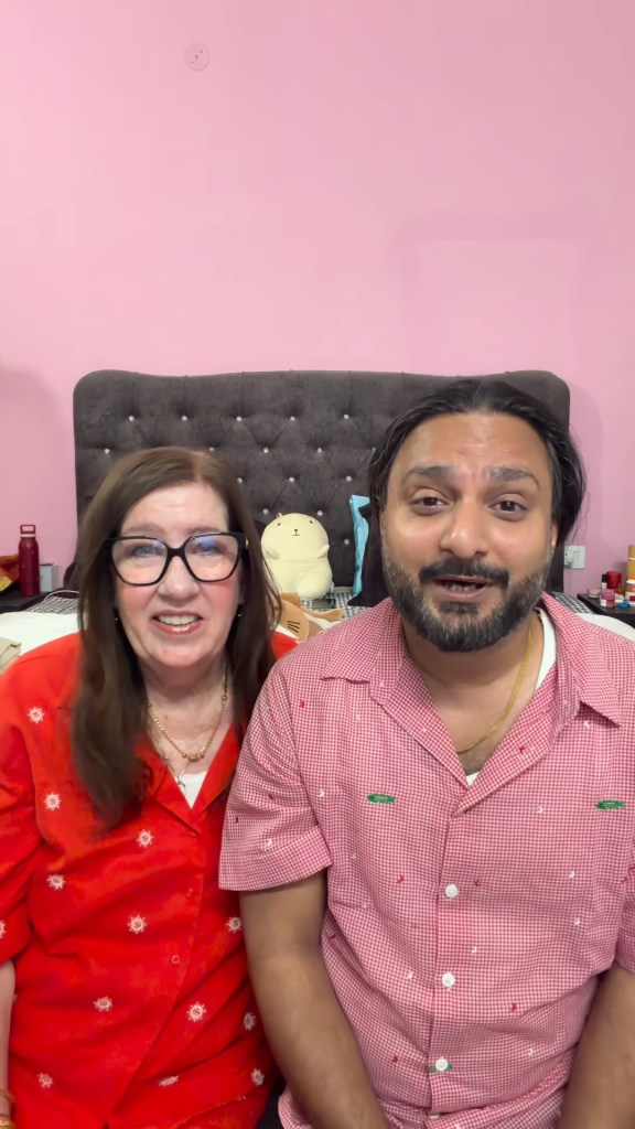 Jenny Slatten and Sumit Singh smiling for a photo.