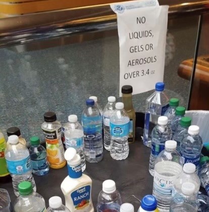 Bottles of water, juice, and ranch dressing confiscated by the TSA due to liquid restrictions.