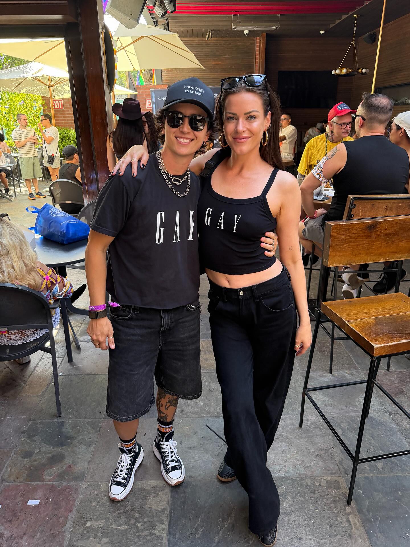 Dayna Kathan and a friend pose for a photo.