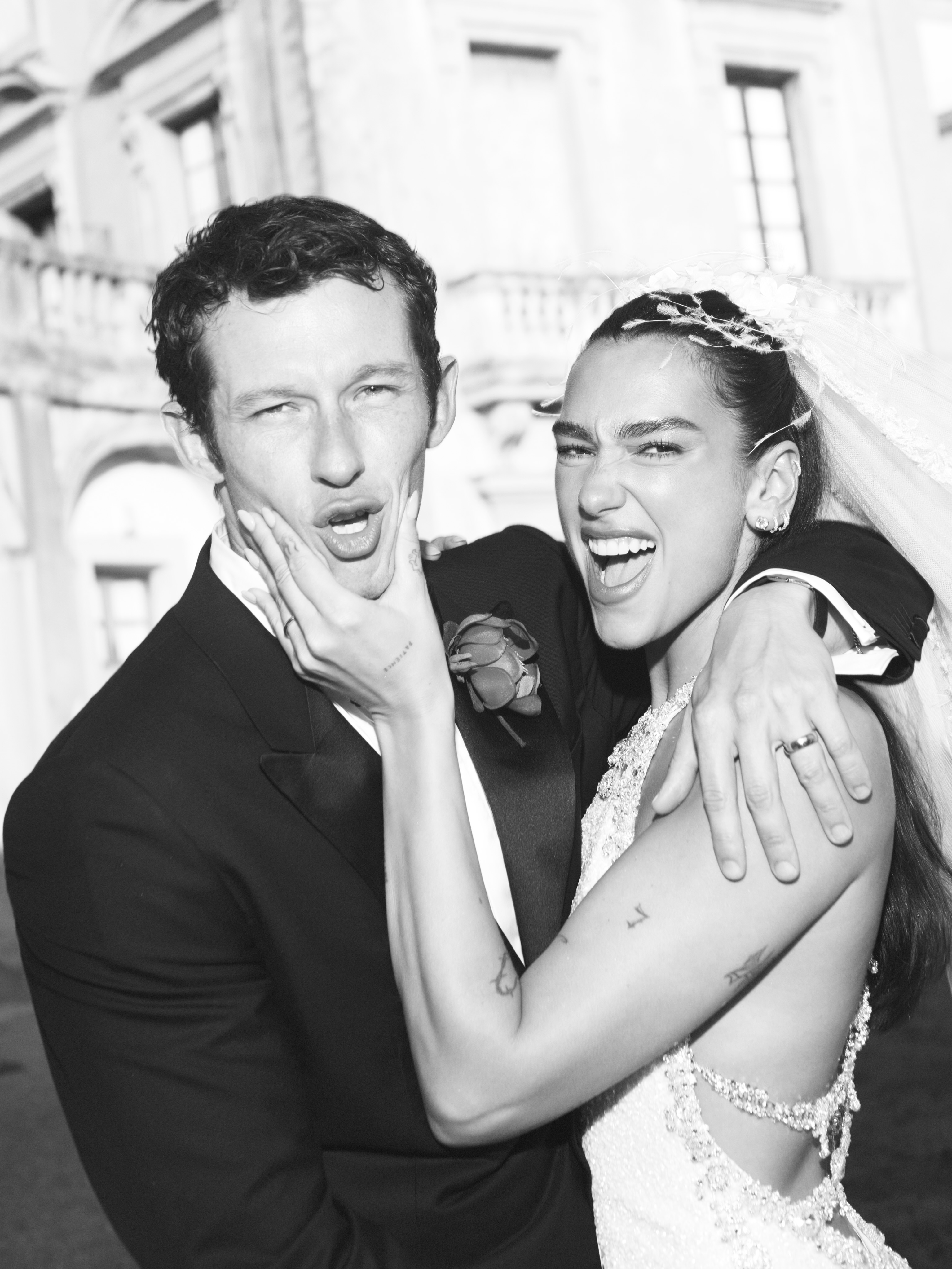 Dua Lipa and husband Callum Turner making funny faces.