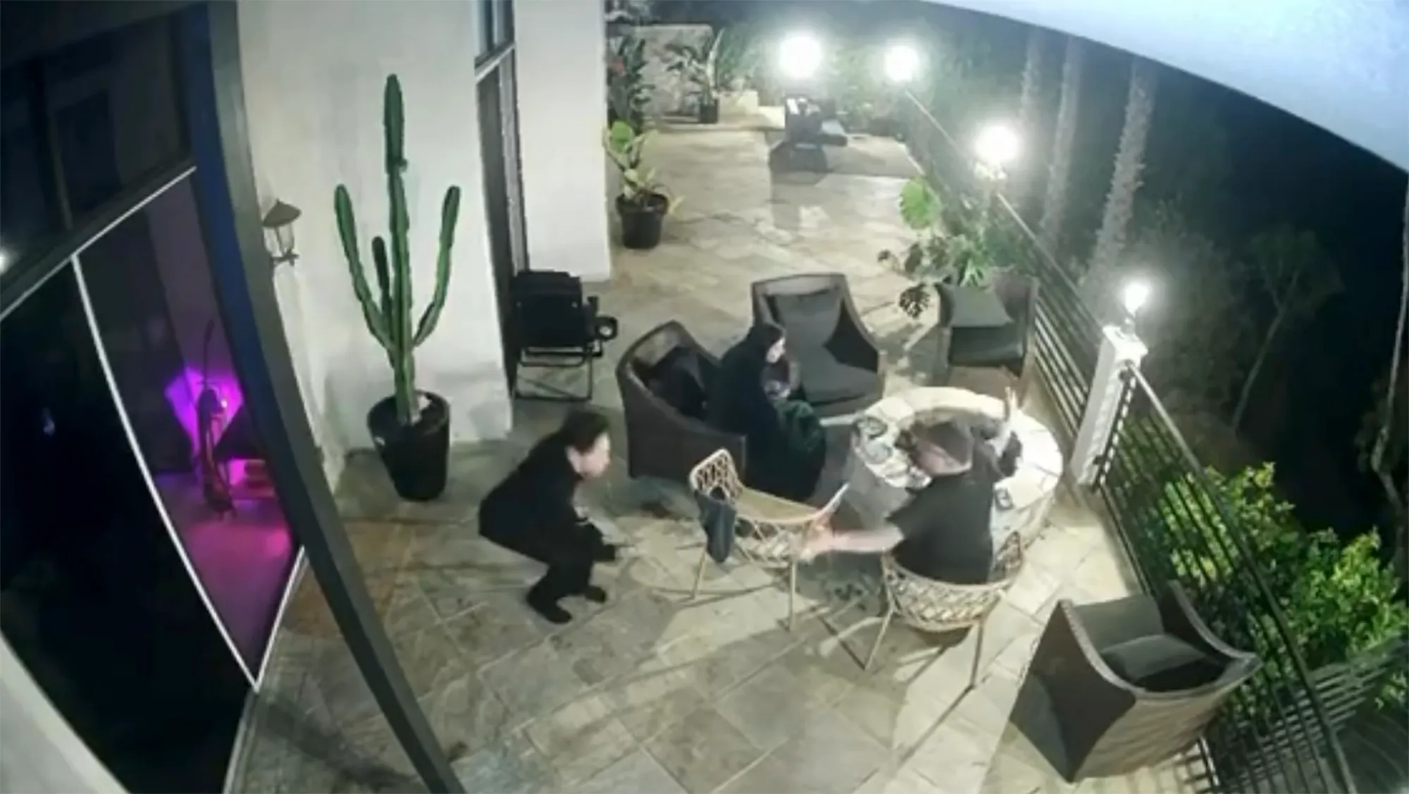 Security camera footage showing Tom Sandoval appearing to push Victoria Robinson's father towards a fire pit.
