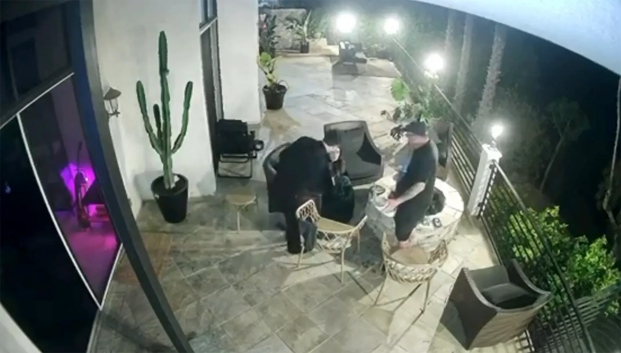 Tom Sandoval appears to shove Victoria Robinson's father towards a lit firepit.