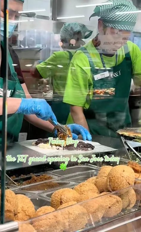 Workers preparing food at the T&T supermarket grand opening in San Jose.