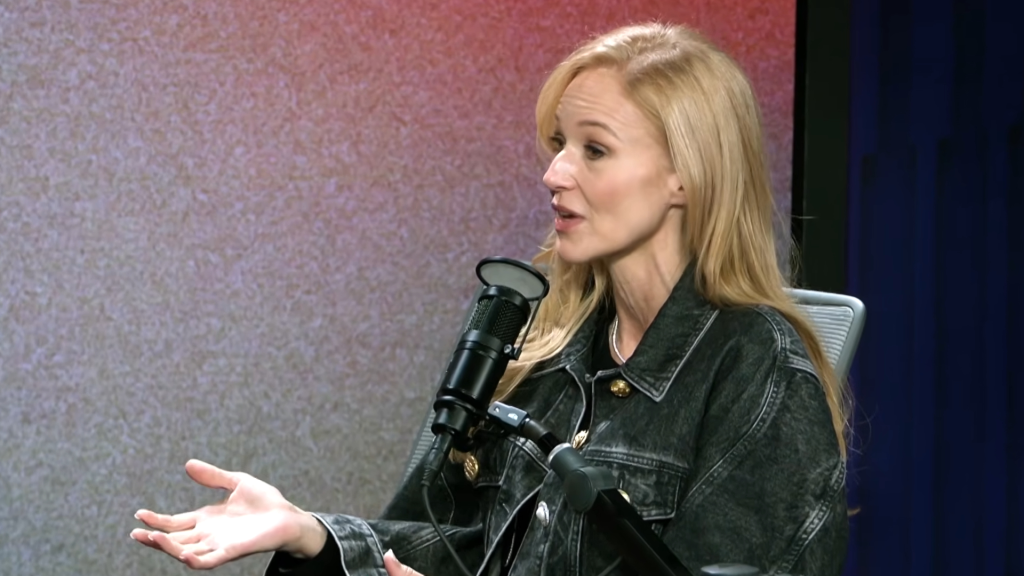 Singer Jewel talking into a microphone.